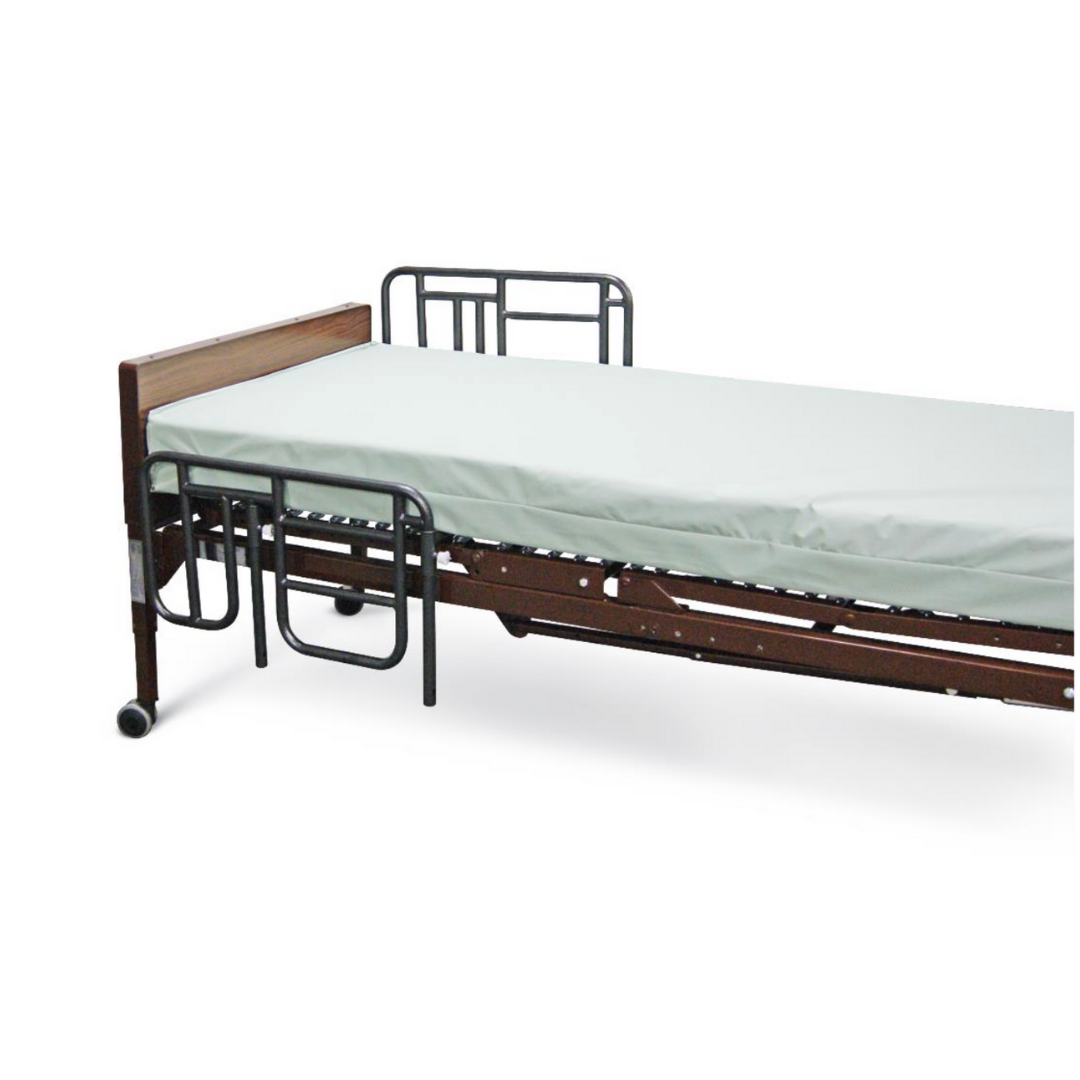 The Medline Bed Rails for Medline Homecare Beds provide patient safety, featuring sturdy metal rails, a thin white mattress, a wooden headboard, and wheels on one end for easy mobility and installation.